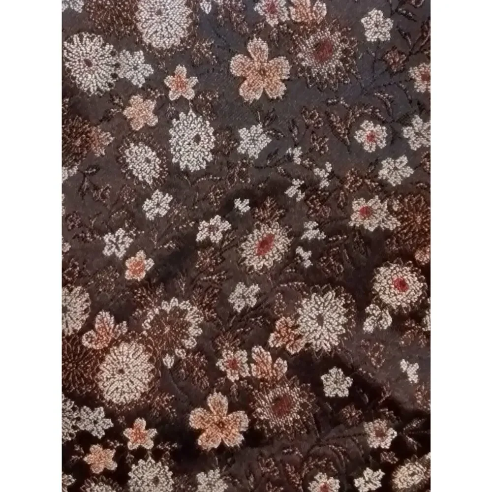 Gray tapestry shorts. Silver and rusty flowers on black background